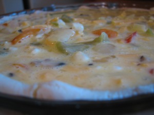 The filled quiche waiting for the oven